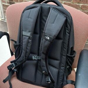 Black and rose gold metallic backpack north face